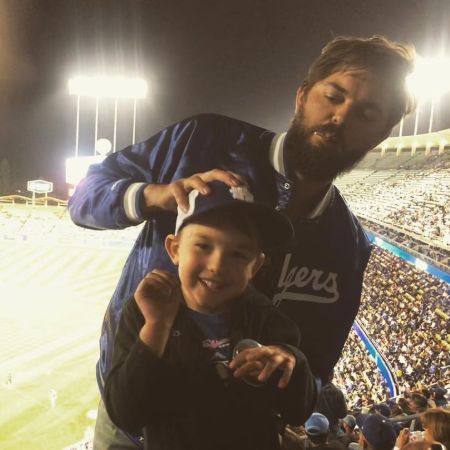 Nick Thune with his son at the stadium. 